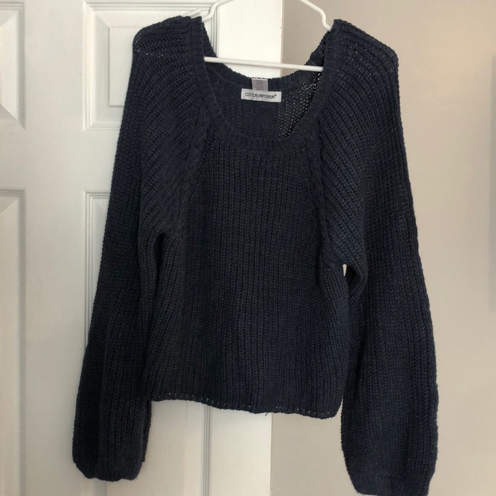 Light blue sweater with flared sleeves